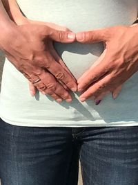 Close-up of hands holding heart shape