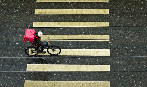 Man with bicycle on street