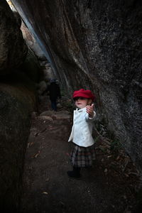 High angle view of man sitting on rock