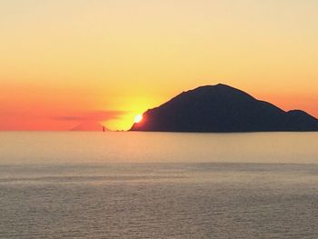 Scenic view of sea at sunset