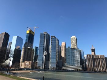 View of skyscrapers against blue sky