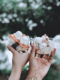 Midsection of woman holding ice cream