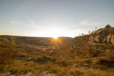 Scenic view of landscape against sky during sunset