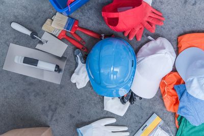 Directly above shot of various work tools on floor