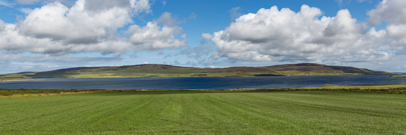 Panoramic view of field against sky