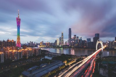 Illuminated city against sky at night