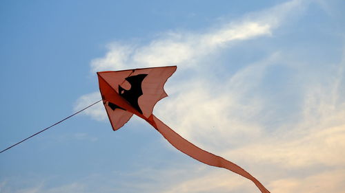 Low angle view of flag against sky during sunset