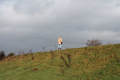 Built structure on field against sky