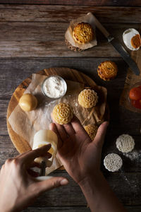 High angle view of person preparing food on table