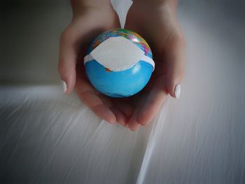 Close-up of person holding ball