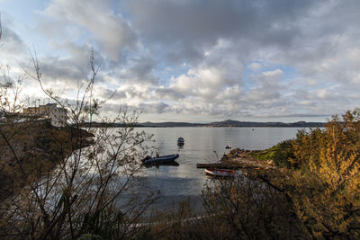 Scenic view of bay against sky