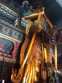 Low angle view of buddha statue at temple