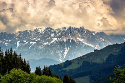 Scenic view of snowcapped mountains against sky