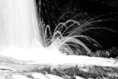 Scenic view of waterfall against sky