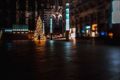 Illuminated buildings in city at night