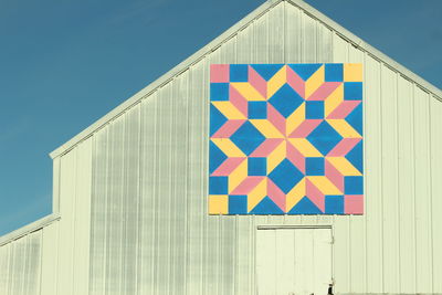 Low angle view of colorful pattern on barn