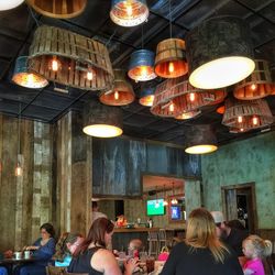 Crowd of illuminated light bulb hanging on wall