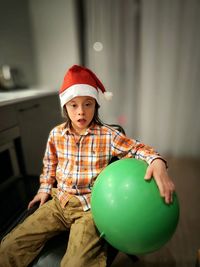 Cute boy, santa clause hat, christmas, ball, kerstman, balloon, sitting,