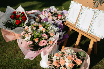 Midsection of woman with bouquet