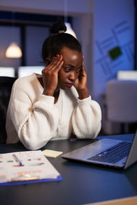 Woman working late in office