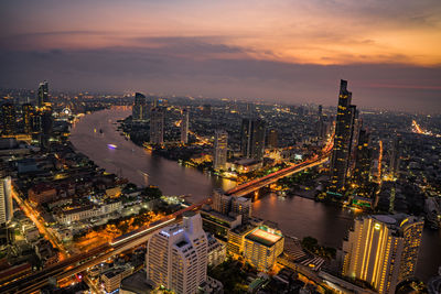 Aerial view of illuminated city at night