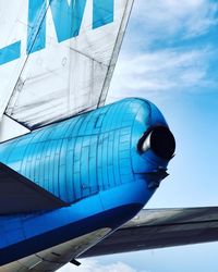 Low angle view of airplane against sky