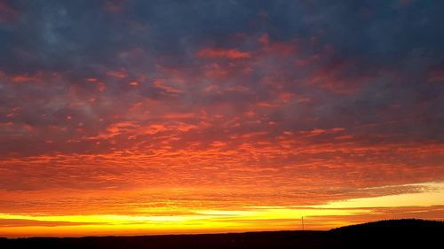 Low angle view of dramatic sky during sunset