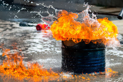 Autumn leaves against fire on water