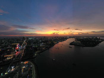 High angle view of illuminated buildings against sky during sunset