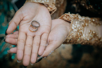 Close-up of couple holding hands