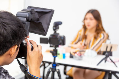 Portrait of woman photographing