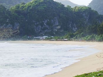 Scenic view of beach against mountain