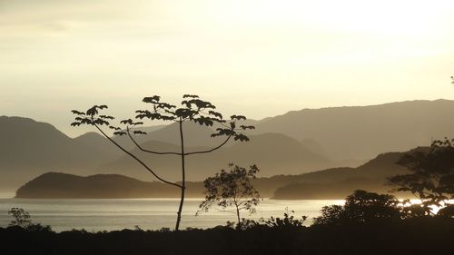 Scenic view of calm lake against mountain range