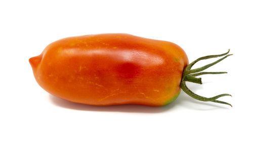 Close-up of orange slice against white background