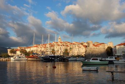 Boats moored at harbor