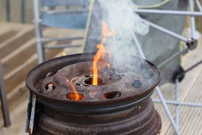 High angle view of fire burning on wood