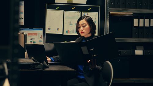 Young woman using laptop at home