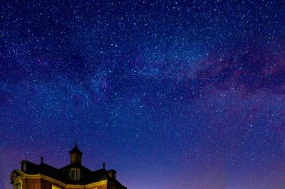 Low angle view of building against sky at night