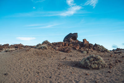 Rock formations on landscape against sky