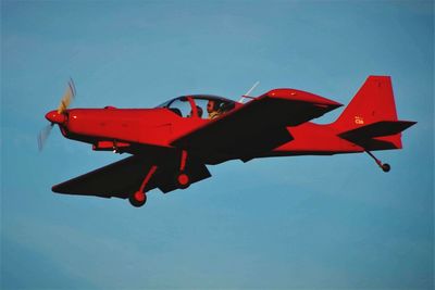 Low angle view of airplane flying in sky