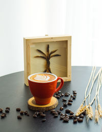 Close-up of coffee cup on table