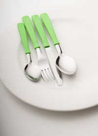 High angle view of eggs in plate on table