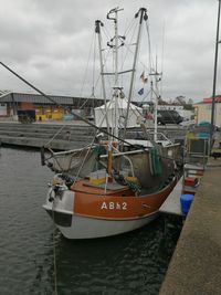 Boats moored at harbor