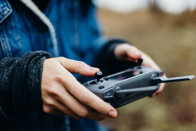 Close-up of man holding camera