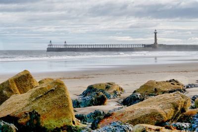 Scenic view of sea against cloudy sky