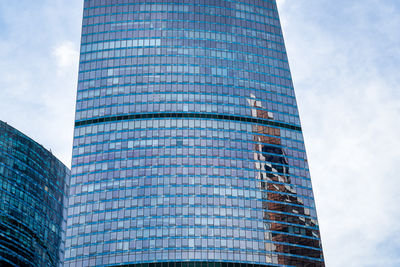 Low angle view of modern building against sky