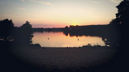 Scenic view of river at sunset