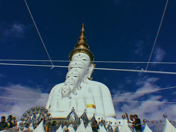 Low angle view of traditional building against blue sky