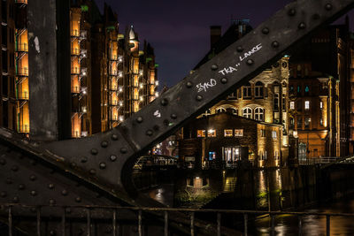 Illuminated city against sky at night