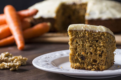 Close-up of carrot cake in plate on table